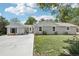 Charming gray home with well-maintained lawn, offering a blend of comfort and curb appeal in a serene setting at 9630 W 38Th Ave, Wheat Ridge, CO 80033