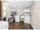 Functional laundry room featuring a washer, dryer, sink, and storage shelves for convenience at 9630 W 38Th Ave, Wheat Ridge, CO 80033