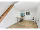 An open living space featuring light wood floors and ladder to the loft area at 9630 W 38Th Ave, Wheat Ridge, CO 80033