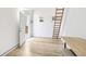 Bright living space with light wood floors and a ladder leading to the loft at 9630 W 38Th Ave, Wheat Ridge, CO 80033