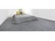 Cozy loft bedroom with soft gray carpet, comfy bedding, and simple decor at 9630 W 38Th Ave, Wheat Ridge, CO 80033
