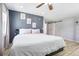 Comfortable main bedroom with a barn door and hardwood floors at 9630 W 38Th Ave, Wheat Ridge, CO 80033