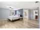Main bedroom with a ensuite bathroom, hardwood floors, and calming paint colors at 9630 W 38Th Ave, Wheat Ridge, CO 80033