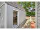 Backyard view of a shed entrance to the living space with backyard access at 9630 W 38Th Ave, Wheat Ridge, CO 80033