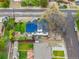 Aerial view of home with fenced backyard and solar panels on roof at 12212 W 60Th Pl, Arvada, CO 80004
