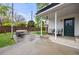 A well-kept backyard with ample patio space, comfy seating, and access to the home's entrance at 12212 W 60Th Pl, Arvada, CO 80004
