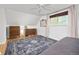 Cozy bedroom with ample storage featuring a ceiling fan and hardwood floors at 12212 W 60Th Pl, Arvada, CO 80004