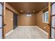 A cozy room with plush carpet, neutral walls, a double door entry, and a window with natural light at 12212 W 60Th Pl, Arvada, CO 80004