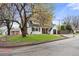 Charming home with a well-manicured lawn, dormer windows, and a cozy covered front porch at 12212 W 60Th Pl, Arvada, CO 80004