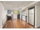 Bright and modern living space with sleek wood flooring, a charming kitchenette, and recessed lighting at 12212 W 60Th Pl, Arvada, CO 80004
