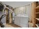 Functional utility room with washer, dryer, and efficient heating system for home comfort at 12212 W 60Th Pl, Arvada, CO 80004
