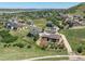 High angle aerial view of large luxury home and its manicured surroundings at 372 Castlemaine Ct, Castle Rock, CO 80104