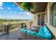 Inviting covered balcony featuring comfortable outdoor furniture and a scenic view of the surrounding neighborhood at 372 Castlemaine Ct, Castle Rock, CO 80104
