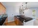 Attractive home bar with granite counters and built-in cabinetry at 372 Castlemaine Ct, Castle Rock, CO 80104