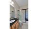Bathroom featuring granite countertops, tiled floors, and glass-enclosed shower with built-in bench at 372 Castlemaine Ct, Castle Rock, CO 80104