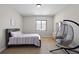 Comfortable bedroom featuring a swing chair and ample natural light at 372 Castlemaine Ct, Castle Rock, CO 80104