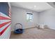 Bright bedroom featuring neutral walls and a playful trampoline and rocking horse at 372 Castlemaine Ct, Castle Rock, CO 80104