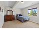 Bedroom featuring a dresser, large window, and bright natural light at 372 Castlemaine Ct, Castle Rock, CO 80104