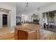 Open-concept kitchen with a large island, hardwood floors, and modern appliances at 372 Castlemaine Ct, Castle Rock, CO 80104