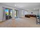Spacious living room with large windows and a comfortable leather sectional at 372 Castlemaine Ct, Castle Rock, CO 80104