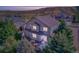 Aerial view of the back of the home showing the backyard landscaping and private patio at 3779 Aspen Hollow Ct, Castle Rock, CO 80104