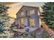 Outdoor patio with dining set, and well-maintained backyard at 3779 Aspen Hollow Ct, Castle Rock, CO 80104