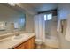 Bathroom with neutral cabinets, sink and shower/tub combo at 3779 Aspen Hollow Ct, Castle Rock, CO 80104