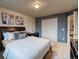 Bedroom featuring a comfortable bed, large closet, and a modern television at 3779 Aspen Hollow Ct, Castle Rock, CO 80104