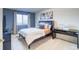 Bedroom features a cozy bed, neutral carpet, and a bright window with views at 3779 Aspen Hollow Ct, Castle Rock, CO 80104