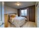 Cozy bedroom featuring natural light from the window and carpet flooring at 3779 Aspen Hollow Ct, Castle Rock, CO 80104