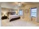 Relaxing main bedroom suite with a king-size bed, ceiling fan, and two windows at 3779 Aspen Hollow Ct, Castle Rock, CO 80104