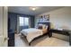 Charming bedroom featuring a large window, a desk, and a comfortable bed at 3779 Aspen Hollow Ct, Castle Rock, CO 80104
