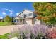 Charming two-story home with a welcoming front porch and a three-car garage at 3779 Aspen Hollow Ct, Castle Rock, CO 80104