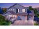 Charming two-story home with a welcoming front porch and a three-car garage at 3779 Aspen Hollow Ct, Castle Rock, CO 80104