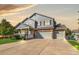 Beautiful two-story home with a brick-accented three-car garage and cozy covered front porch at 3779 Aspen Hollow Ct, Castle Rock, CO 80104