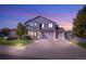 Charming two-story home featuring a three-car garage, inviting porch, and well-manicured front yard at 3779 Aspen Hollow Ct, Castle Rock, CO 80104