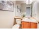 Cozy powder room with attractive wall decor and a well-maintained vanity at 3779 Aspen Hollow Ct, Castle Rock, CO 80104