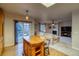 Open floorplan view from the kitchen to the living room and sliding glass doors at 3779 Aspen Hollow Ct, Castle Rock, CO 80104