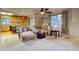 Open floorplan featuring a comfortable living room, visible kitchen, and center island at 3779 Aspen Hollow Ct, Castle Rock, CO 80104