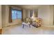 Bright seating area featuring a large window and neutral walls with accent artwork at 3779 Aspen Hollow Ct, Castle Rock, CO 80104