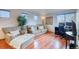 Comfortable living room featuring a cozy chair, sofa, and a work space at 3779 Aspen Hollow Ct, Castle Rock, CO 80104