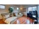Comfortable living room with hardwood floors, sofa, armchair and desk setup at 3779 Aspen Hollow Ct, Castle Rock, CO 80104