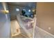 Inviting staircase leading to a cozy living room with natural light and hardwood floors at 3779 Aspen Hollow Ct, Castle Rock, CO 80104