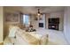 Spacious living room featuring a corner fireplace, TV, and comfortable seating at 3779 Aspen Hollow Ct, Castle Rock, CO 80104