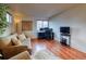 Living area featuring a sofa, armchair and hardwood floors at 3779 Aspen Hollow Ct, Castle Rock, CO 80104