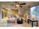 Comfortable living room with a sectional sofa and view into the kitchen at 3779 Aspen Hollow Ct, Castle Rock, CO 80104