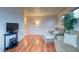 Upstairs living area featuring hardwood floors, comfortable seating, and natural light at 3779 Aspen Hollow Ct, Castle Rock, CO 80104