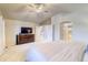 Large main bedroom with vaulted ceilings, ceiling fan, neutral walls, and connecting bathroom at 3779 Aspen Hollow Ct, Castle Rock, CO 80104