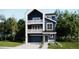 New construction with two-story home featuring balconies, a welcoming garage and stylish facade at 7185 Waterleaf Trl, Littleton, CO 80125