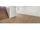 Spacious basement area featuring wood floors, natural light, and a staircase at 1330 Quebec St, Denver, CO 80220